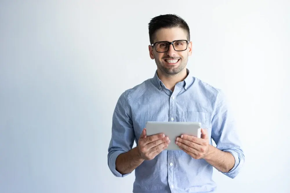 portrait-cheerful-excited-tablet-user-wearing-eyeglasses